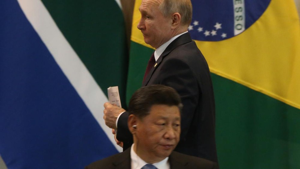BRASILIA, BRAZIL - NOVEMBER,14 (RUSSIA OUT) Chinese President Xi Jinping (L) and Russian President Vladimir Putin (R) attend the BRICS Summit in Brasilia, Brazil, November 14, 2019. Leaders of Russia, China, Brazil, India and South Africa have gateheres in Brasila for the BRICS Leaders Summit. (Photo by Mikhail Svetlov/Getty Images)