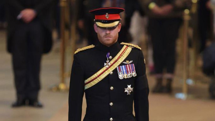 1243305227 LONDON, ENGLAND - SEPTEMBER 17: Prince Harry, Duke of Sussex holds a vigil beside the coffin of their grandmother as it lies in state on the catafalque inside Westminster Hall on September 17, 2022 in London, England. Queen Elizabeth II's grandchildren mount a family vigil over her coffin lying in state in Westminster Hall. Queen Elizabeth II died at Balmoral Castle in Scotland on September 8, 2022, and is succeeded by her eldest son, King Charles III. (Photo by Aaron Chown - WPA Pool/Getty Images)