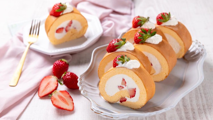 Strawberry swiss roll cake with whipped cream