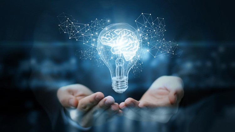 Light bulb with brain inside the hands of the businessman. The concept of the business idea.