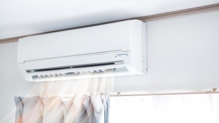 Air conditioner blowing warm air