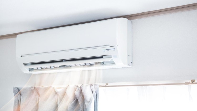 Air conditioner blowing warm air