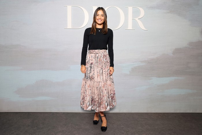 Tennis player Emma Raducanu combined a floral pink blush skirt with a casual black top. Classy!Photo: Getty Images for Christian Dior/Pascal Le Segretain