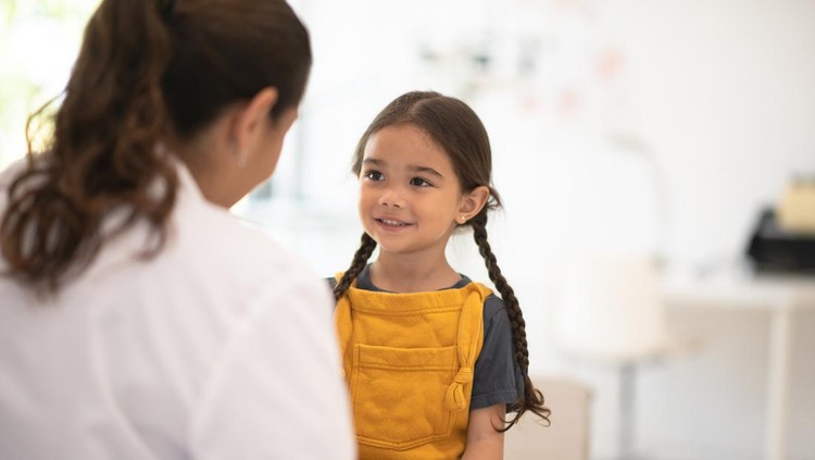 Little girl receiving a check up from her Doctor