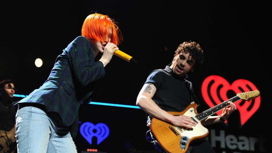 WASHINGTON, DC - DECEMBER 16:  Hayley Williams (L) and Taylor York of Paramore perform onstage during Hot 99.5s Jingle Ball 2013, presented by Overstock.com, at Verizon Center on December 16, 2013 in Washington, D.C.  (Photo by Kevin Mazur/Getty Images for Clear Channel)