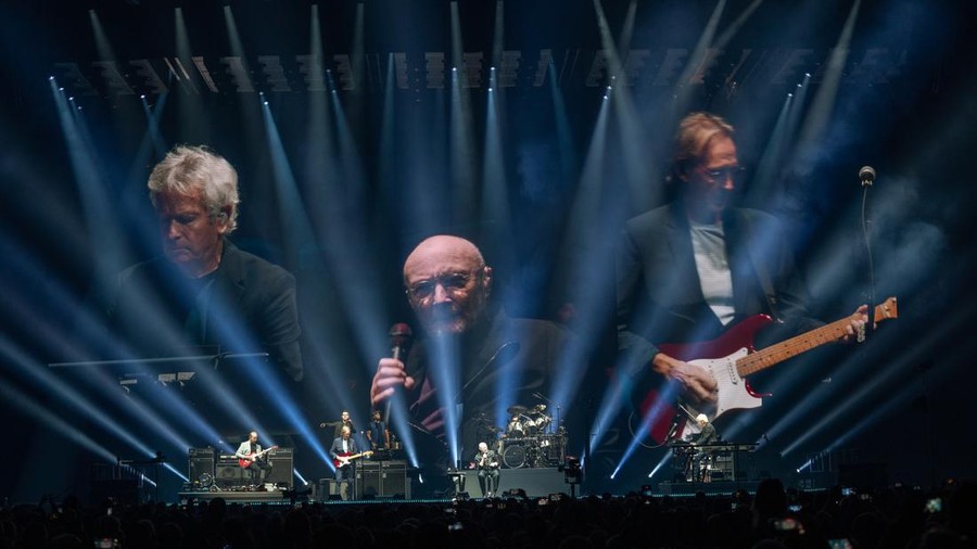ELMONT, NEW YORK - DECEMBER 10: Mike Rutherford (L), Phil Collins and Tony Banks of Genesis perform in concert during the 
