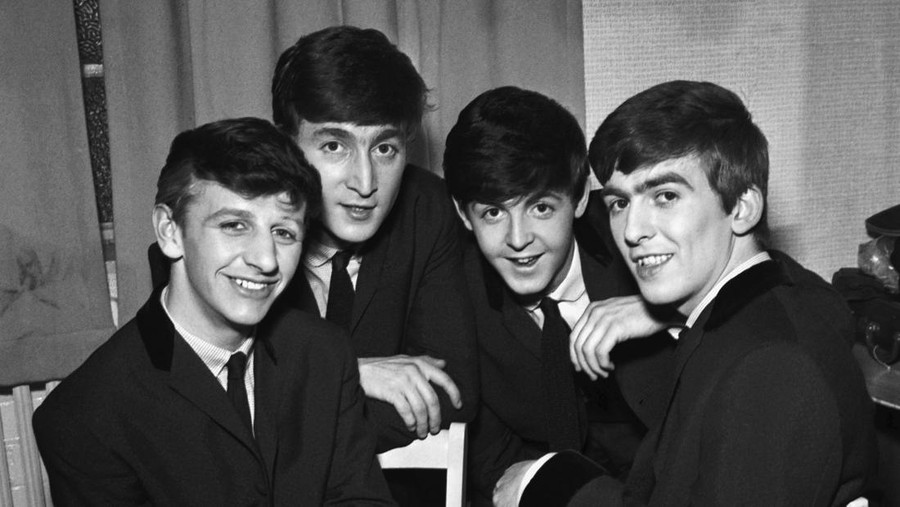The Beatles pose for an eraly group portrait, backstage, (L-R) Ringo Starr, John Lennon, Paul McCartney, George Harrison, 1962. (Photo by Harry Hammond/V&A Images/Getty Images)