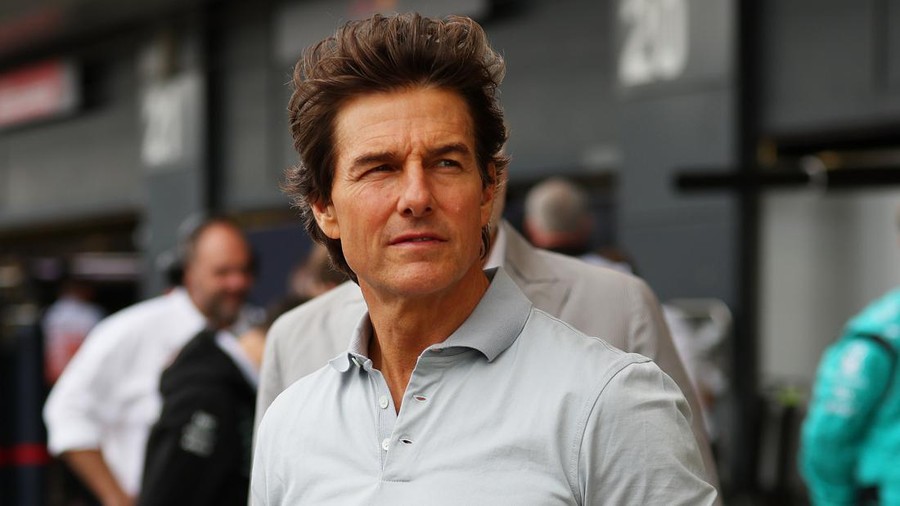 NORTHAMPTON, ENGLAND - JULY 03: Tom Cruise looks on in the pit lane before the F1 Grand Prix of Great Britain at Silverstone on July 03, 2022 in Northampton, England. (Photo by Bryn Lennon - Formula 1/Formula 1 via Getty Images)