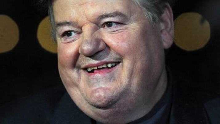 In this file photo taken on October 21, 2012 British actor Robbie Coltrane attends the premiere for the film 'Great Expectations' on the closing night of the 56th BFI London Film Festival in central London. - Scottish actor Robbie Coltrane, who played Hagrid in the Harry Potter films, has died aged 72, his agent said on Friday, October 14. (Photo by CARL COURT / AFP)