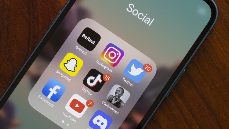 Portland, OR, USA - Aug 23, 2022: Assorted popular social media apps - BeReal, Instagram, Twitter, Snapchat, TikTok, Clubhouse, Facebook, YouTube, and Discord - are seen on an iPhone. BeReal is a French social media app rising in popularity, and can be anti-social in some ways. Users receive a notification at a random time once a day saying 'Time to BeReal'. This opens up a two-minute window for the user to post a picture of what they are currently doing. The purpose of this is to capture an authentic, unfiltered snapshot of a user's life.
