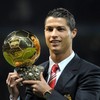 Manchester United's Portuguese midfielder Cristiano Ronaldo poses with the Ballon D'or trophy before their UEFA Champions league group E football match against Aalborg at Old Trafford in Manchester, north-west England on December 10 2008. AFP PHOTO/A