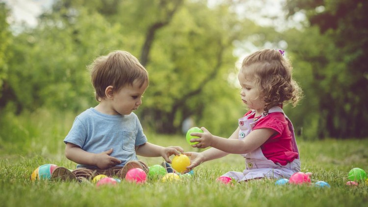 Little boy and girl having fun outdoors