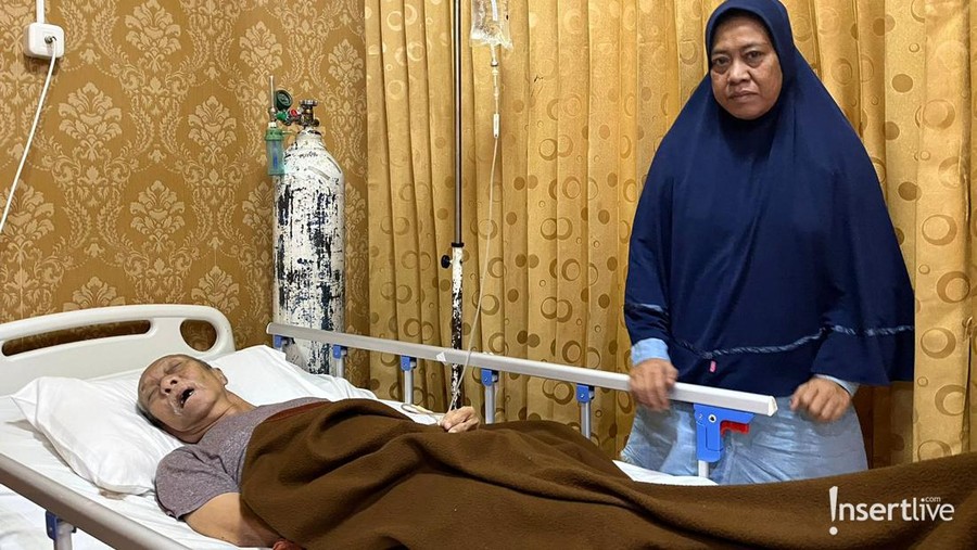 Pak Ogah yang didampingi sang istri