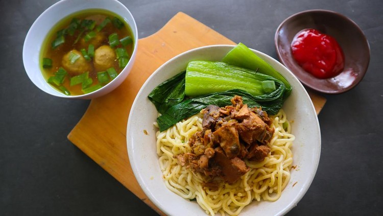 mie ayam or noodles chicken is traditional food from indonesia, asia made from noodle, chicken, chicken broth, spinach, sometimes with meatball.