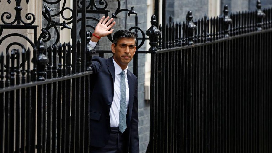 LONDON, ENGLAND - OCTOBER 25: British Prime Minister Rishi Sunak poses after taking office outside Number 10 in Downing Street on October 25, 2022 in London, England. Rishi Sunak will take office as the UK's 57th Prime Minister today after he was appointed as Conservative leader yesterday. He was the only candidate to garner 100-plus votes from Conservative MPs in the contest for the top job. He said his aim was to unite his party and the country. (Photo by Jeff J Mitchell/Getty Images)