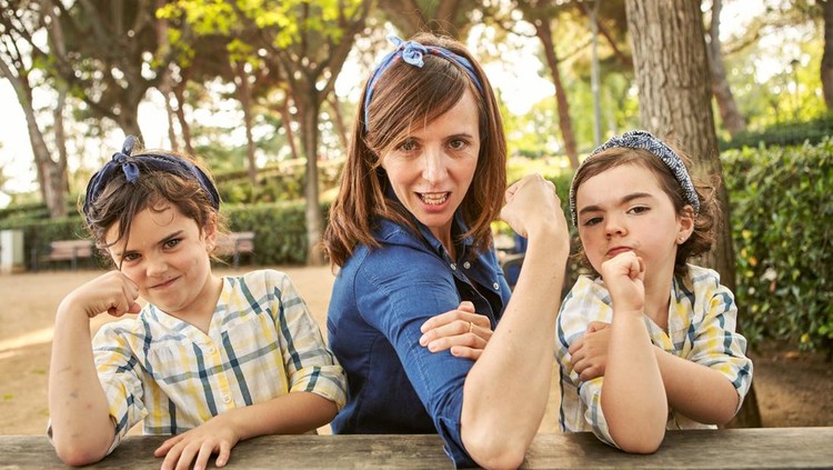 Strong mom flexing her arms - Girl power