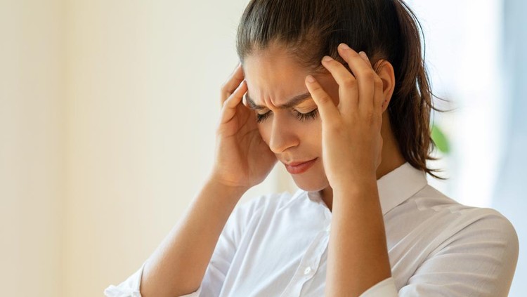 Woman suffering from a headache