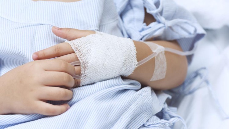 Hand of the sick child with saline solution with Space for text.