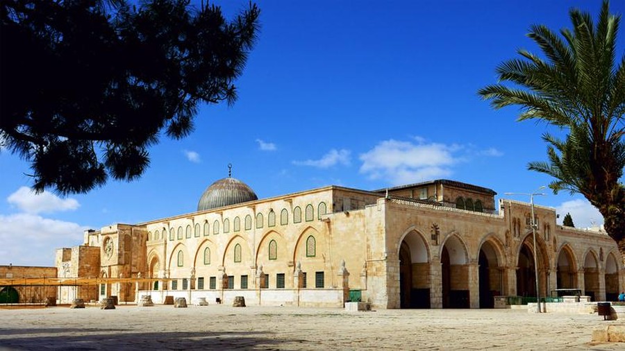 Arched South gateway with Siliver dome of Al-Aqsa Mosque at the square of Golden Dome of the Rock, in an Islamic shrine located on the Temple Mount in the Old City Jerusalem, Israel