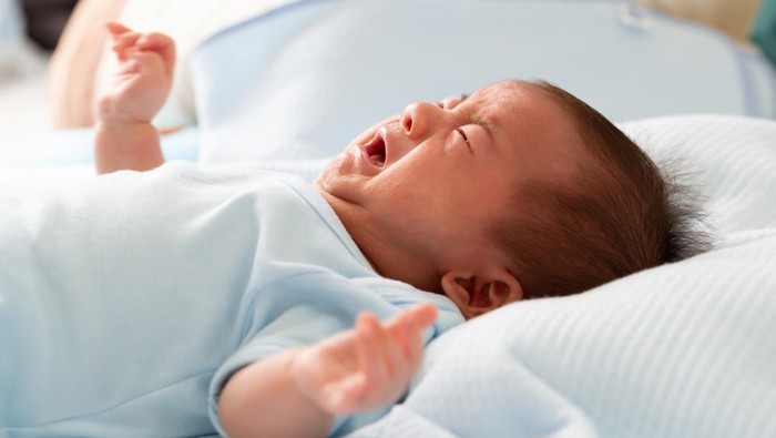Asian baby newborn crying from diarrhea colic symptoms