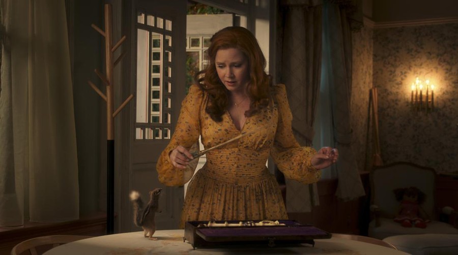 (L-R): Pip (voiced by Griffin Newman) and Amy Adams as Giselle in Disney's live-action DISENCHANTED, exclusively on Disney+. Photo courtesy of Disney. © 2022 Disney Enterprises, Inc. All Rights Reserved.