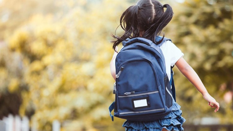 Back to school. Cute asian child girl with backpack running and going to school with fun