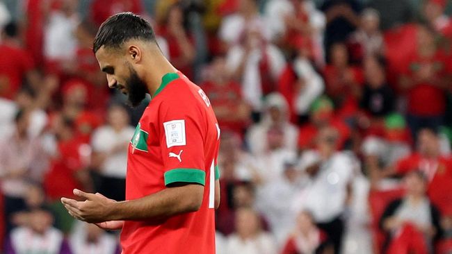 Moment of Moroccan players raising the Palestinian flag after destroying Spain