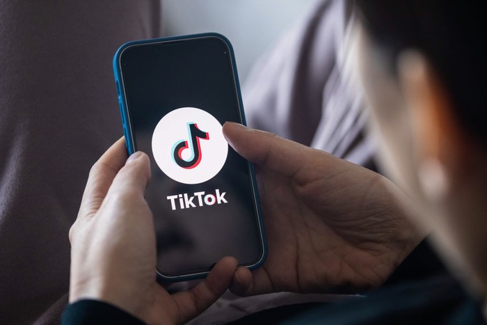 JAPAN - 2022/12/14: In this photo illustration, a TikTok App Logo is displayed on a mobile phone. (Photo Illustration by Stanislav Kogiku/SOPA Images/LightRocket via Getty Images)