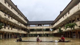 FOTO: Tahun Baru Malaysia 'Disambut' Banjir Bandang dan Longsor