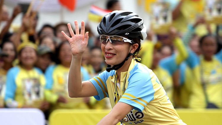 BANGKOK, THAILAND - 2015/12/11: Thailand's Princess Bajrakitiyabha waves to the crowd as she cycles in the 