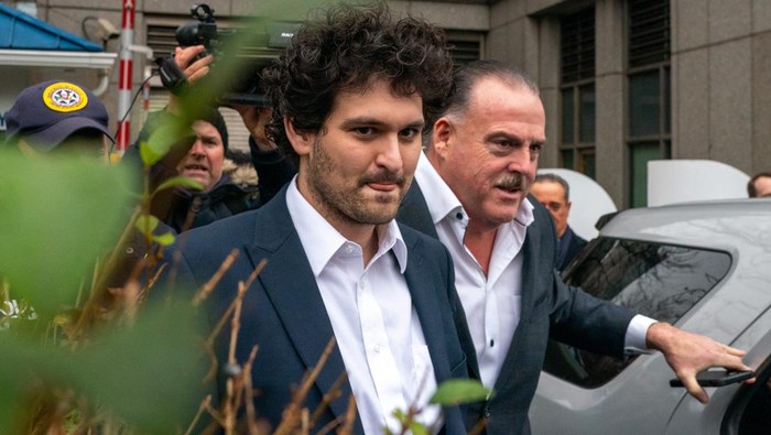 NEW YORK, NY - DECEMBER 22: FTX founder Sam Bankman-Fried leaves Manhattan Federal Court after his arraignment and bail hearings on December 22, 2022 in New York City. Bankman-Fried, who was indicted on December 9th and arrested 3 days later by Bahamas law enforcement at the request of U.S. prosecutors, consented to extradition to the U.S. where he is facing eight criminal counts of fraud, conspiracy and money-laundering offenses which includes making illegal political contributions. He is potentially facing life in prison if convicted.  He was released on $250 million bond with the bail package requiring him to stay with his parents in California. (Photo by David Dee Delgado/Getty Images)
