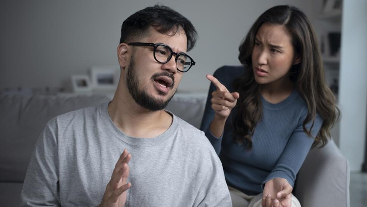 Asian couple arguing shouting blaming each other of problem, husband and wife fighting at home, relationship Problems concept