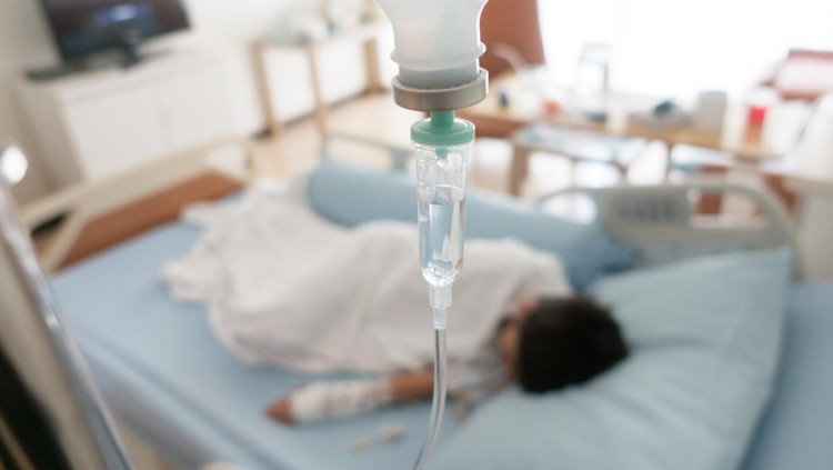 Little boy get sick from influenza need to be admitted to hospital with saline intravenous (iv)  in-line hand pressure