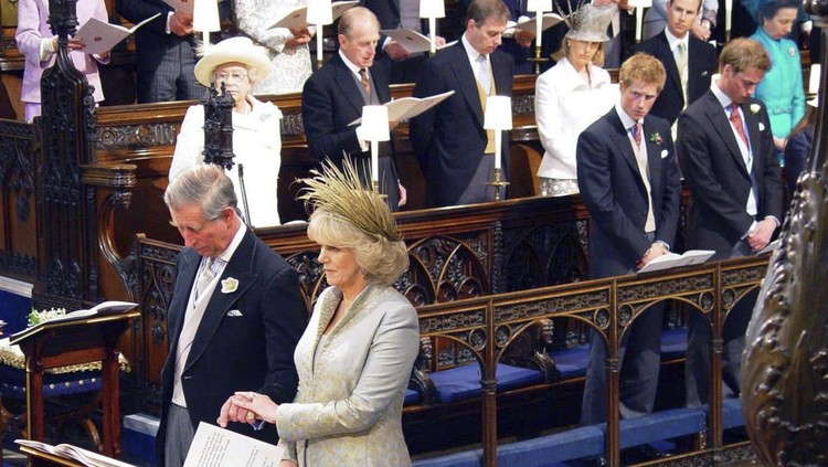 FILE - Britain's Prince Charles and his new wife, Camilla, the Duchess of Cornwall, with other members of the royal family during their wedding blessing at Windsor Castle's St George's Chapel, Windsor, England, on April, 9 2005. An explosive memoir reveals many facets of Prince Harry, from bereaved boy and troubled teen to wartime soldier and unhappy royal. From accounts of cocaine use and losing his virginity to raw family rifts, “Spare” exposes deeply personal details about Harry and the wider royal family. It is dominated by Harry's rivalry with brother Prince William and the death of the boys’ mother, Princess Diana in 1997. (Chris Young/Pool Photo via AP, File)