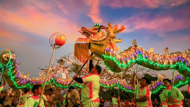Bangkok, Thailand - February 20 2016: A group of people perform a dragon dance during Chinese new year's celebration