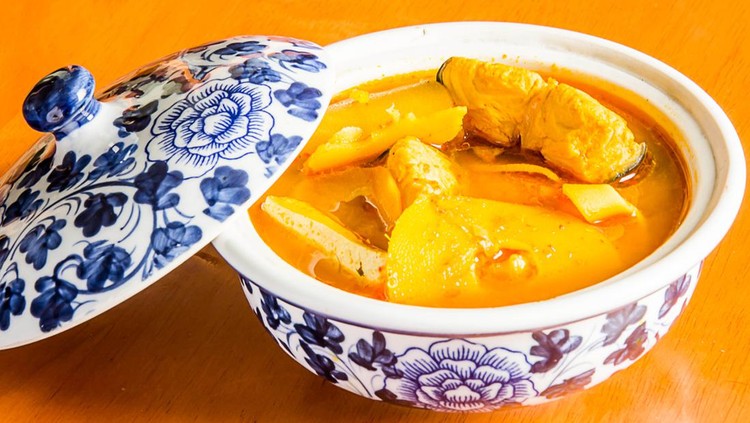 Southern Thai Spicy Sour Yellow Curry with Sea Bass and Coconut Shoots, Sour soup made of Tamarind Paste or Turmeric.