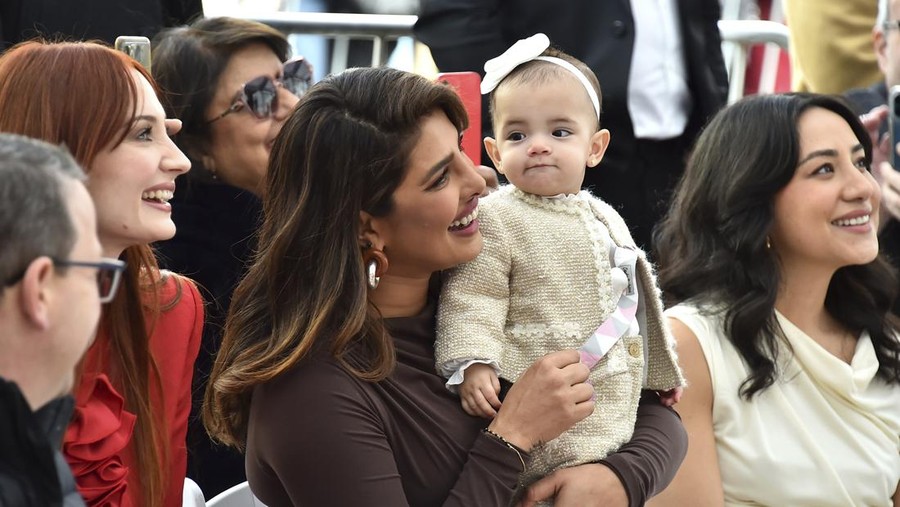 Sophie Turner, from left, Priyanka Chopra and her daughter Malti Marie Chopra Jonas attend a ceremony honoring The Jonas Brothers with a star on The Hollywood Walk of Fame on Monday, Jan. 30, 2023, in Los Angeles. (Photo by Jordan Strauss/Invision/AP)