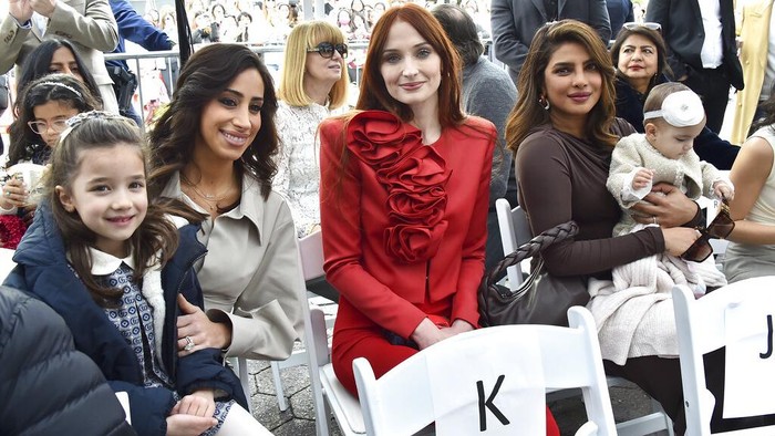 Sophie Turner, from left, Priyanka Chopra and her daughter Malti Marie Chopra Jonas attend a ceremony honoring The Jonas Brothers with a star on The Hollywood Walk of Fame on Monday, Jan. 30, 2023, in Los Angeles. (Photo by Jordan Strauss/Invision/AP)