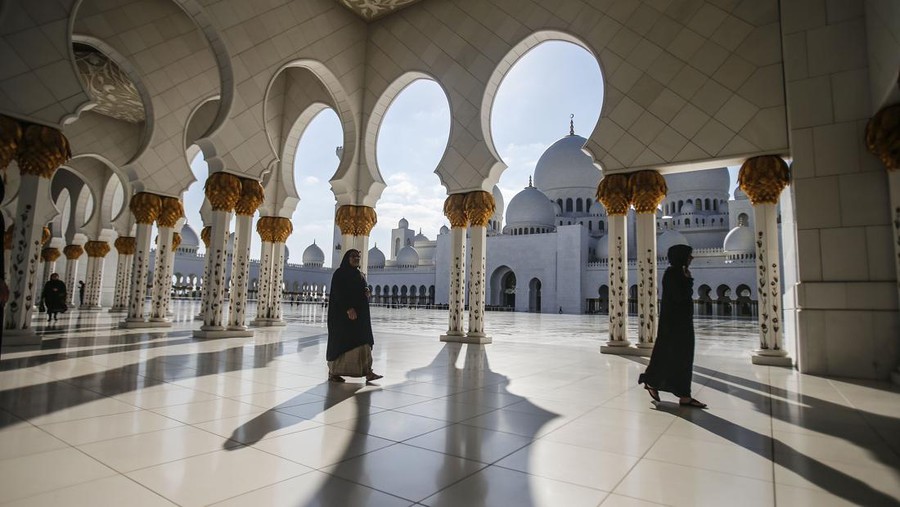 ABU DHABI, UNITED ARAB EMIRATES -JANUARY 22: Sheikh Zayed Grand Mosque is seen in Abu Dhabi, United Arab Emirates on January 22, 2015. Abu Dhabi's iconic landmark is the Sheikh Zayed Grand Mosque, which features eighty-two white domes. Built between 1996 and 2007, it was designed to be an architectural wonder that incorporated both modern and classic Islamic artistic styles. Greek and Italian white marble covers the exterior, while Islamic calligraphy decorates the inside. It is named after the founder and first President of the UAE, the late Sheikh Zayed bin Sultan Al Nahyan. He chose the location and took substantial influence on the architecture and the design of the mosque. (Photo by Ali Hassan/Anadolu Agency/Getty Images)