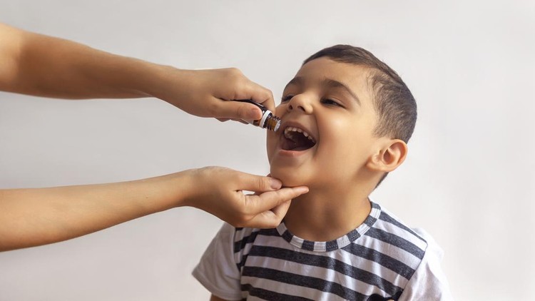 Child immunization with little drop in clinic. Doctor providing immunization vaccines for the immune system of infant. Child's Immunization, Children's Vaccination, Health conception.