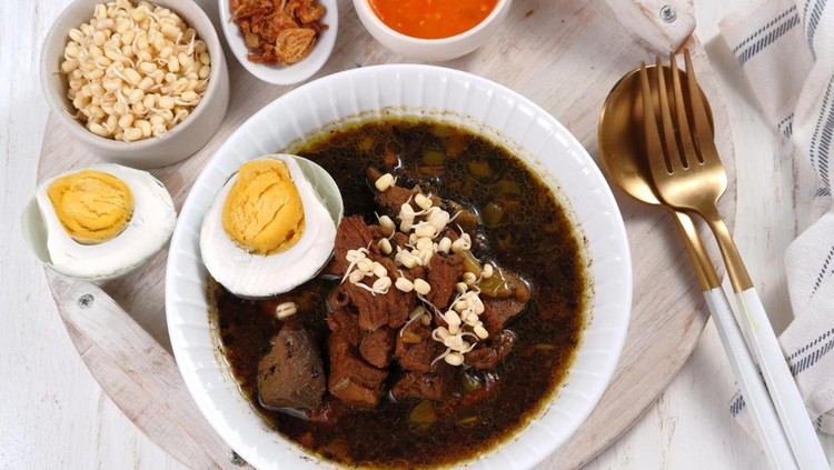 1450818893 Rawon is Beef Black Soup Originally from East Java, Indonesia.served with salted egg,bean sprouts,and chilli sauce