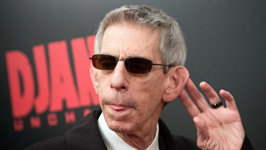 FILE PHOTO: Comedian Richard Belzer gestures as he attends the 'Django Unchained' premiere in New York December 11, 2012. REUTERS/Andrew Kelly/File Photo