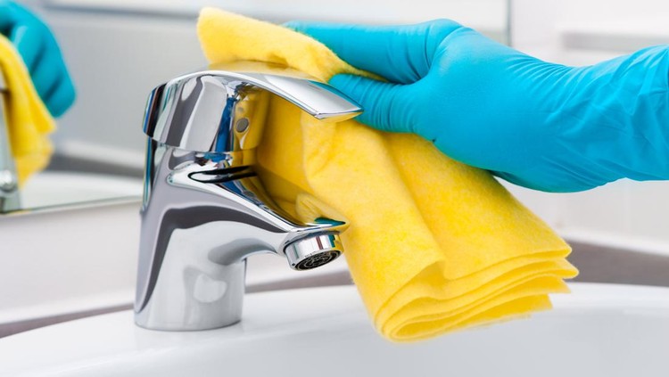 509278027 Woman doing chores in bathroom, cleaning tap