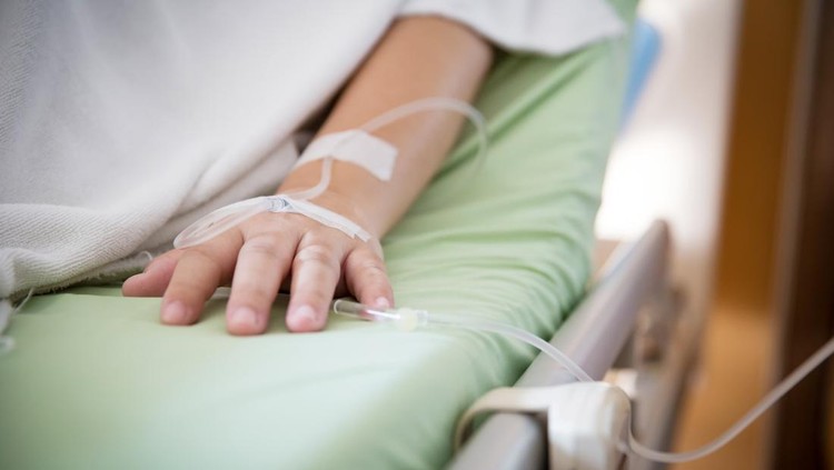 Focus patient's hand has get the saline solution syringe on it. Illness and treatment. Health insurance plan. Reimbursement and Medical expenses. image for illustration, copy space, article.