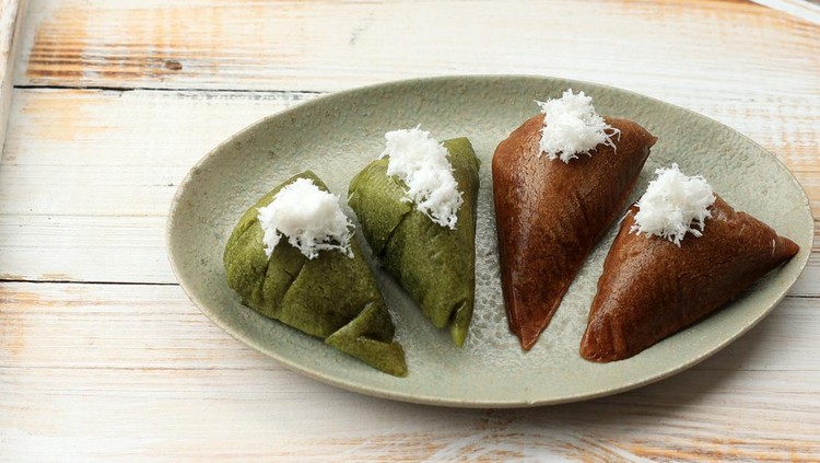 1456071636 Apem or Apang Cake, Traditional Indonesian Steam Cake Made from Rice Flour and Palm Sugar. Topping with Grated Coconut
