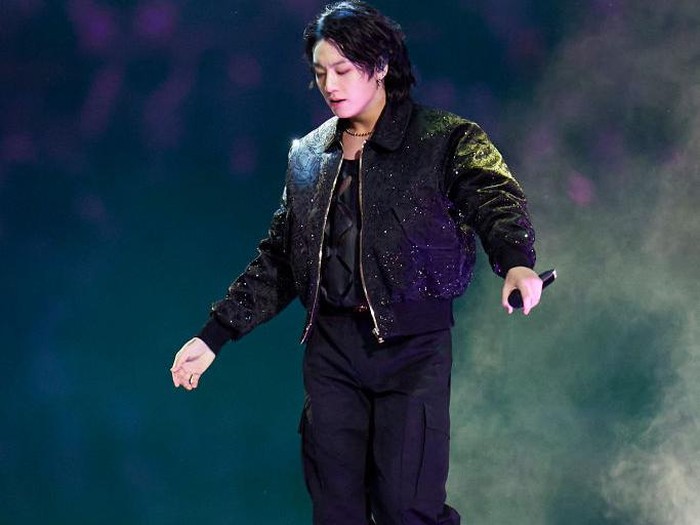 AL KHOR, QATAR - NOVEMBER 20:  South Korean pop star Jung Kook of BTS performs on stage during opening ceremony ahead of the FIFA World Cup Qatar 2022 Group A match between Qatar and Ecuador at Al Bayt Stadium on November 20, 2022 in Al Khor, Qatar. (Photo by Quality Sport Images/Getty Images)