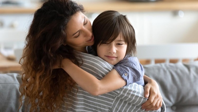 1198401603 School age frustrated son receives psychological support from loving caring young mother, mom embracing little kid boy express care and love soothing him, motherhood, protection, sharing pain concept