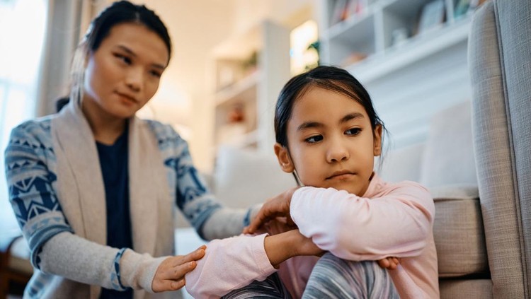 1462286067 Carina Asian mother comforting her distraught daughter at home.
