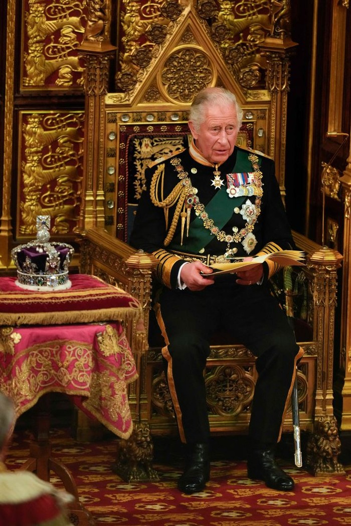 Britain's Prince Charles, Prince of Wales (R) sits by the The Imperial State Crown (L) in the House of Lords Chamber during the State Opening of Parliament at the Houses of Parliament, in London, on May 10, 2022. - Queen Elizabeth II will miss Tuesday's ceremonial opening of Britain's parliament, as Prime Minister Boris Johnson tries to reinvigorate his faltering government by unveiling its plans for the coming year. (Photo by Alastair Grant / POOL / AFP) (Photo by ALASTAIR GRANT/POOL/AFP via Getty Images)