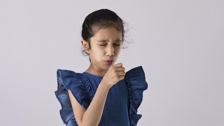 Girl feeling unwell and coughing as a symptom of virus disease or bronchitis